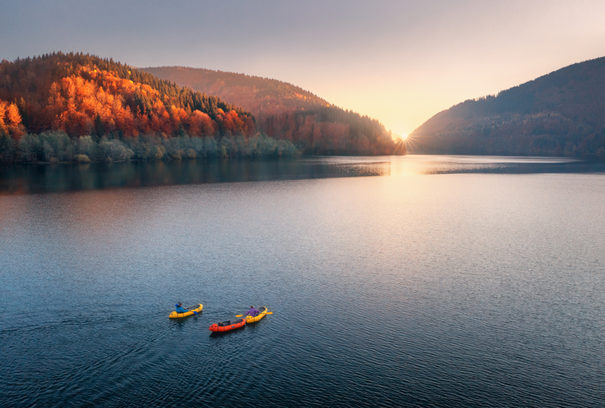 Rafts On A River At Sunrise