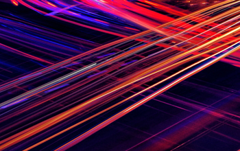 Red, Orange, And Blue Light Trails Streaking Across