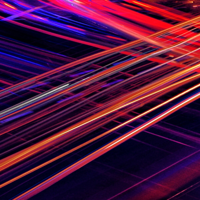 Red, Orange, And Blue Light Trails Streaking Across