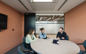 Colleagues talking in office