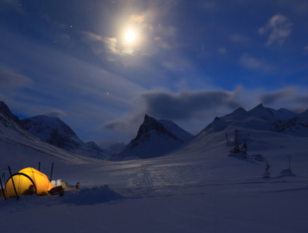 A Camping Tent By A Mountain At Night With The Moon In The Background