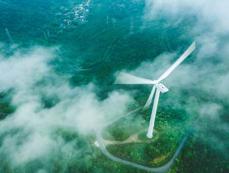 Windmill on green landscape