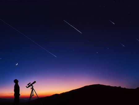 Sunset with telescope and man